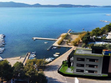 Luxury apartment in a new building, first row by the sea in Sukošan